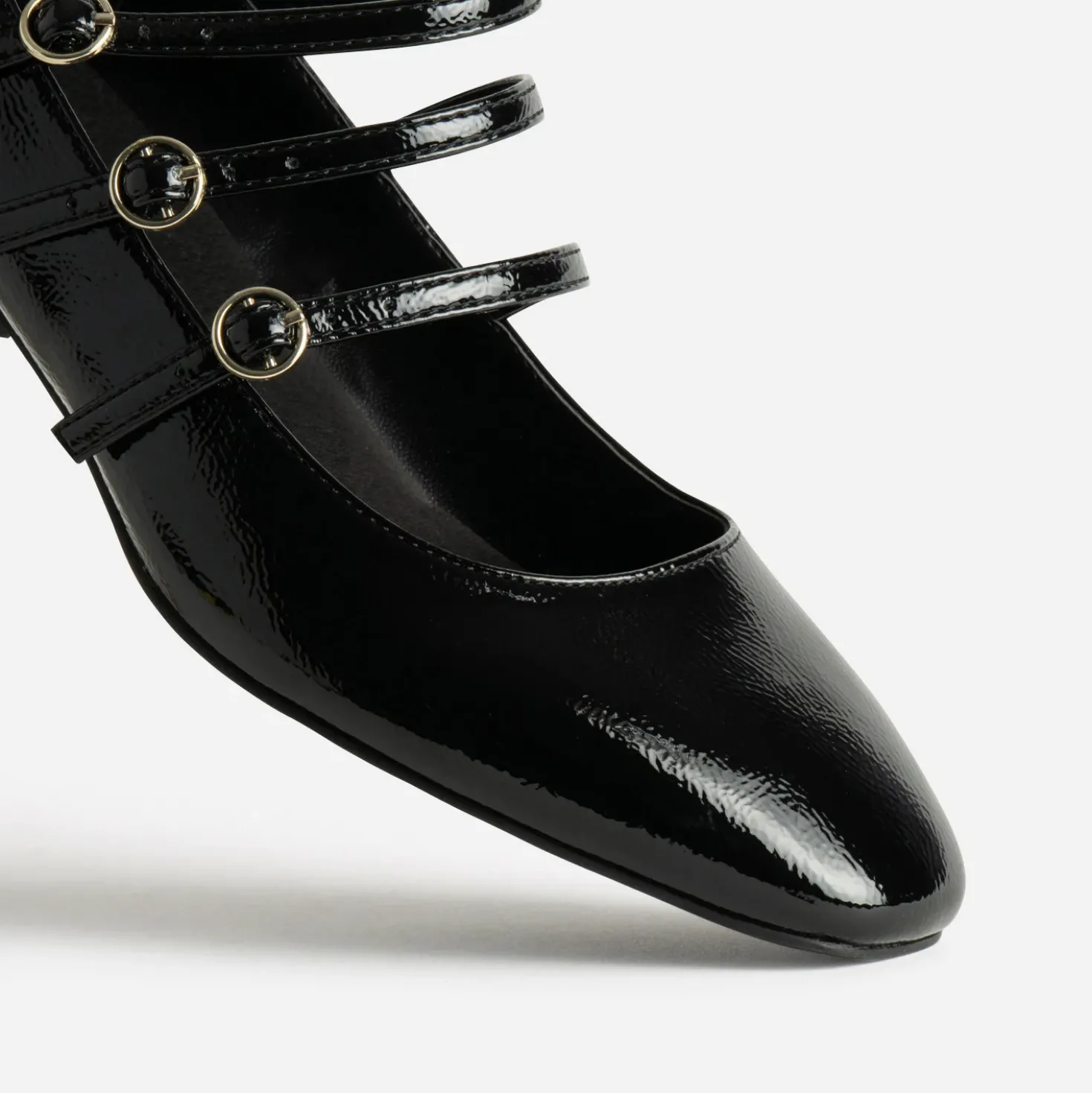 Babies noires cuir verni trois brides