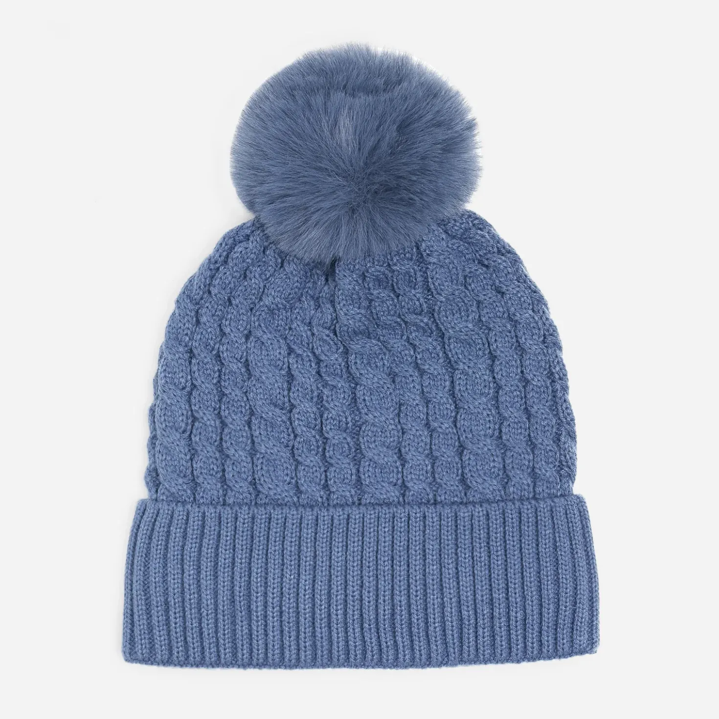 Bonnet bleu tricot à torsades et pompon