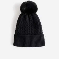Bonnet TEXTO noir en tricot torsadé à pompon