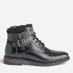 Bottine noire en cuir décor zip et boucle
